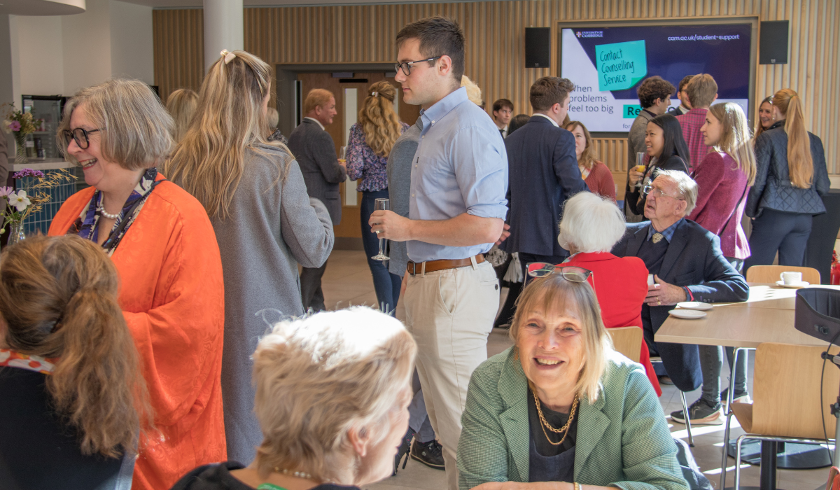 Alumni chatting in the cafe